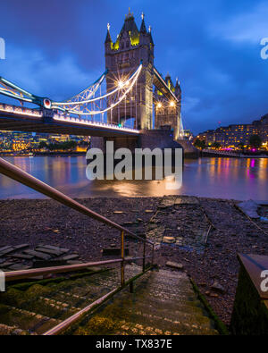 London, UK - June 19th 2019: A view of the magnificent Tower Bridge from the Horselydown Old Stairs which lead down to the shore of the River Thames i Stock Photo