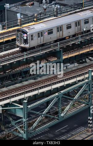 New York City Subway Train on elevated section of line, near Queensboro Plaza, Long Island City, New York, USA