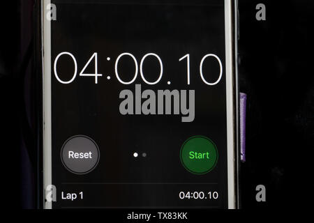 Stop clock on a smart phone showing the time at 4 minutes Stock Photo
