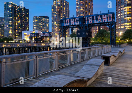 Gantry Plaza State Park at night with Long Island restored Gantries, Long Island City, New York, USA