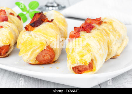 Puff pastry snacks with sausage and bacon Stock Photo