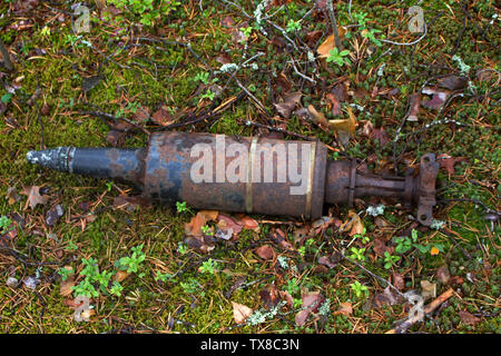 Mortar shell found in the woods. Mortar mine threat for the population, sappers demining Stock Photo