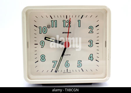Vintage, german metal green alarm clock, isolated on white background, close-up Stock Photo