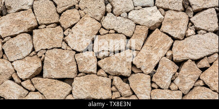 the decorative wall is lined with wild stone, Tenerife, Spain Stock Photo