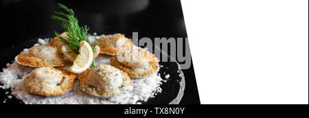 deep fried Hokkaido Scallops Shell with crusty bread serve with lemon and salt panoramic crop designed for using as web banner Stock Photo