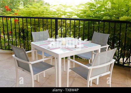 dining table set up in open terrace with beautiful nature view Stock Photo