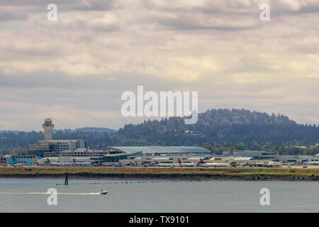 Portland, OR / USA - June 2019: View of concourse D and E with Air Traffic Control (ATC) tower at Portland International Airport (PDX) Stock Photo