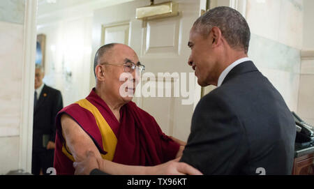 BARACK OBAMA US President greets the Dalai Lama at the White House in June 2016. Photo: White House Stock Photo