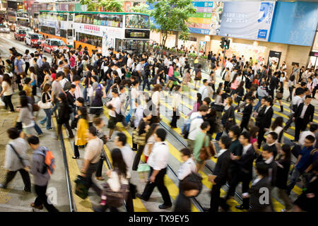 Elevated view of pedestrians crossing a road in Hong Kong, China. Stock Photo