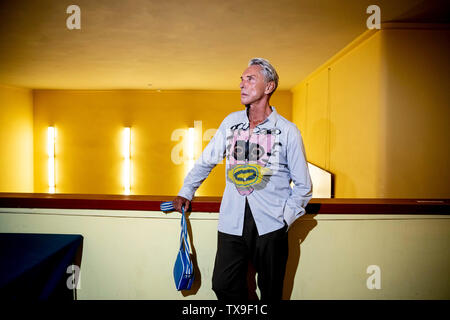 Berlin, Germany. 24th June, 2019. Wolfgang Joop, fashion designer, stands before a joint discussion with the leader of the Left Party Wagenknecht with the headline 'Fashion meets Politics' at the cinema Babylon in Berlin-Mitte. Credit: Christoph Soeder/dpa/Alamy Live News Stock Photo