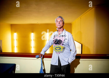 Berlin, Germany. 24th June, 2019. Wolfgang Joop, fashion designer, stands before a joint discussion with the leader of the Left Party Wagenknecht with the headline 'Fashion meets Politics' at the cinema Babylon in Berlin-Mitte. Credit: Christoph Soeder/dpa/Alamy Live News Stock Photo