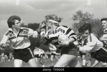 1980s, women playing a game of rugby union, England, UK. In was in this era, that the women's game really developed. In 1982 the first women's international match took place and in 1983 the Women's Rugby Football Union (WRFU) was formed to govern the game in Britain. Stock Photo