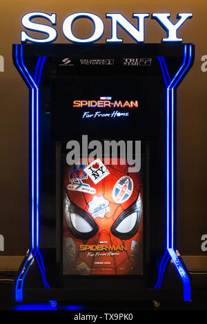 Bangkok, Thailand - Jun 24, 2019: Spider-Man: Far From Home poster and TV screen kiosk display showing movie trailer in theatre. Movie advertisement Stock Photo