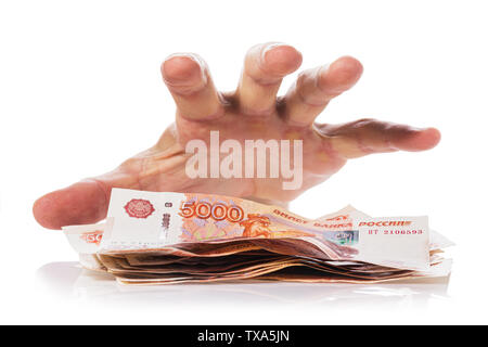 Hand about to grab the money, Isolated on white background. Concept on theft or fraud with currency Stock Photo