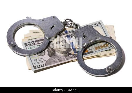 Handcuffs on dollars isolated on white background. Concept on the topic of fraud with foreign exchange transactions Stock Photo