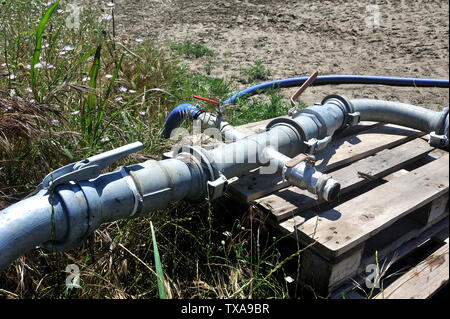 agricultural irrigation system that distributes water pumped into the river in the field Stock Photo