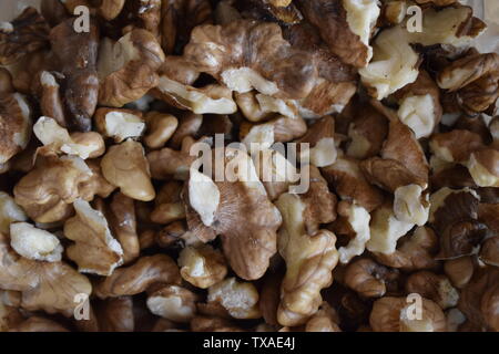 Closeup of big shelled walnuts pile. Big shelled walnuts background Stock Photo