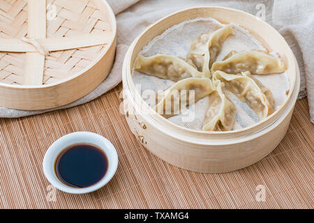 A cage of traditional Chinese food steamed dumplings Stock Photo