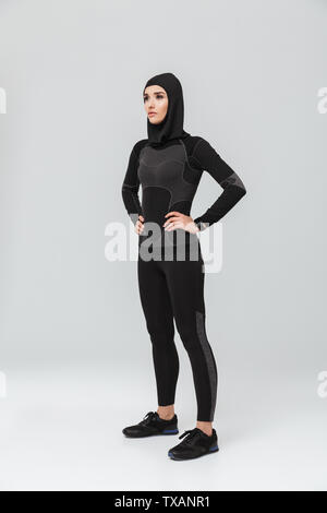 Image of young woman fitness muslim posing isolated over white wall background. Stock Photo