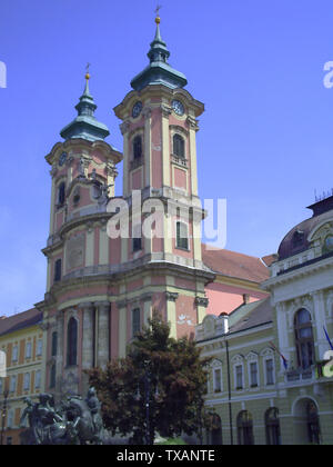 Minorite church in the middle of Eger, Hungary. The Dobo square in Eger. Travel outdoor european background Stock Photo