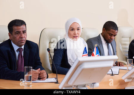 Intercultural group of young delegates or business people Stock Photo