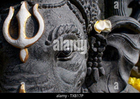 Head shot of a beautiful black Ganesha stone statue located in Ubud, Bali - Indonesia Stock Photo