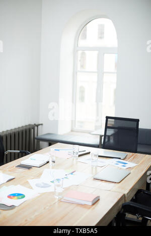 Background image of black and white office interior with wooden meeting table in conference room, copy space Stock Photo