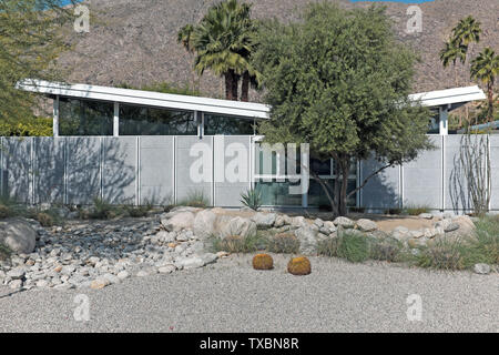 Palm Springs home with inverted gable roof, also known as a butterfly roof, popularized in Palm Springs during the 1950s by architect William Krisel. Stock Photo