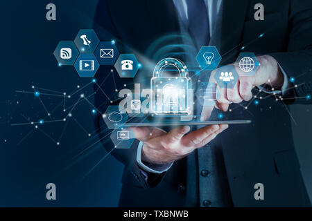 Businessman using tablet computer in office and sells Cryptocurrency Stock Photo