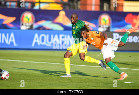 Cairo, Egypt. 24th June, 2019. Jonathan Adjo Kodjia (R) of Cote d'Ivoire scores during the 2019 Africa Cup of Nations Group D match between Cote d'Ivoire and South Africa in Cairo, Egypt, on June 24, 2019. Cote d'Ivoire won 1-0. Credit: Li Yan/Xinhua/Alamy Live News Stock Photo