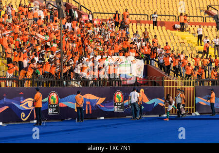 Cairo, Egypt. 24th June, 2019. Jonathan Adjo Kodjia (Bottom R) of Cote d'Ivoire throws his jersey to the fans after the 2019 Africa Cup of Nations Group D match between Cote d'Ivoire and South Africa in Cairo, Egypt, on June 24, 2019. Cote d'Ivoire won 1-0. Credit: Li Yan/Xinhua/Alamy Live News Stock Photo