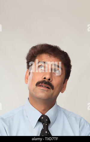 Close up of a businessman looking up Stock Photo