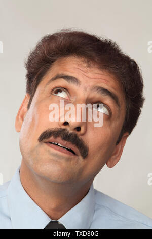 Close up of a businessman looking up Stock Photo