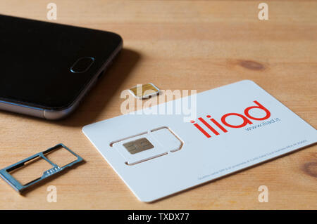 CARRARA, ITALY - JUNE 25, 2019 - A sim card of the French operator Iliad, recently active in Italy ready to be inserted into a smartphone Stock Photo