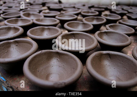 Earthenware clay lamps drying, Dharavi, Mumbai, Maharashtra, India, Asia Stock Photo