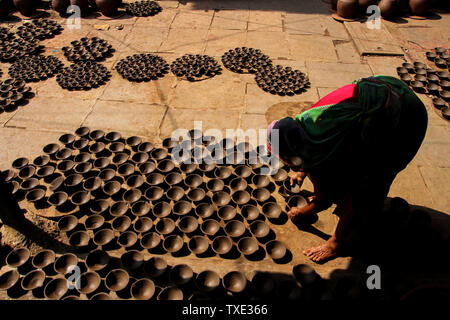 Earthenware clay lamps drying, Dharavi, Mumbai, Maharashtra, India, Asia Stock Photo