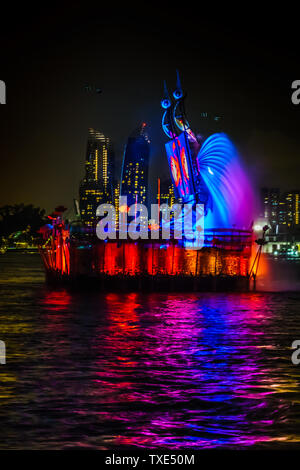 Singapore - Jun 10, 2019: Crane dance at resorts world sentosa, two huge mechanical crane dance with water jets and colorful lighting. Stock Photo