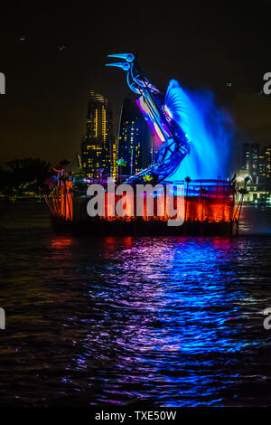 Singapore - Jun 10, 2019: Crane dance at resorts world sentosa, two huge mechanical crane dance with water jets and colorful lighting. Stock Photo