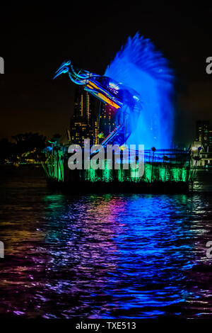 Singapore - Jun 10, 2019: Crane dance at resorts world sentosa, two huge mechanical crane dance with water jets and colorful lighting. Stock Photo