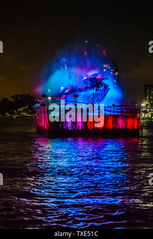 Singapore - Jun 10, 2019: Crane dance at resorts world sentosa, two huge mechanical crane dance with water jets and colorful lighting. Stock Photo