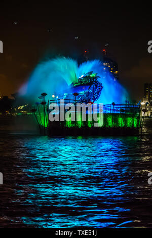 Singapore - Jun 10, 2019: Crane dance at resorts world sentosa, two huge mechanical crane dance with water jets and colorful lighting. Stock Photo