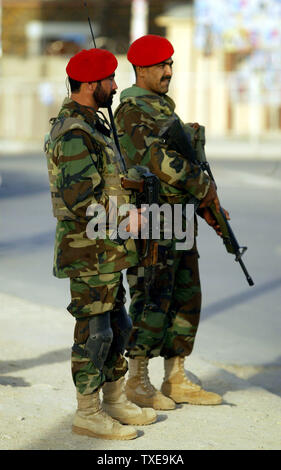 Afghan National Army (ANA) soldiers stands guard at a security checkpoint on the eve of election day in Kabul, Afghanistan on August 19, 2009. UPI/Mohammad Kheirkhah. Stock Photo