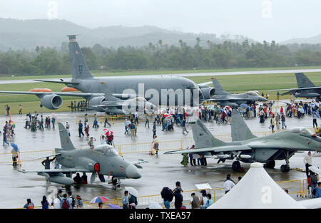 A KC-135 tanker from the 909th Air Refueling Squadron, Kadena Air Base, Japan, and F-16 fighter aircraft from the 35th Fighter Squadron, Misawa Air Base, Japan, is on display on the tarmac during the Langkawi International Maritime and Aerospace exhibition 2003 (LIMA 03) here.  LIMA 03 is one of the premier defense trade show in the world that features over 800 local and international companies and military delegations from about 40 nations that offer state-of-the art aerospace and maritime products. More than 100 aircraft and 80 vessels are on display during the six-day event.     (UPI/AFIE/V Stock Photo
