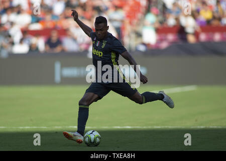 Juventus defender Alex Sandro (12) kicks the ball during the International Champions Cup match between Juventus and Real Madrid at FedEx Field on August 4, 2018 in Landover, Maryland. Photo by Alex Edelman/UPI Stock Photo