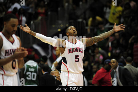 Atlanta Hawks forward Josh Smith raises his hands in the air after  defeating the Chicago Bulls in game 1 of the NBA Eastern Conference  Semifinals at the United Center in Chicago on