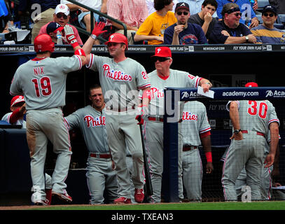 Philadelphia Phillies' Roy Oswalt, left, is greeted by teammate