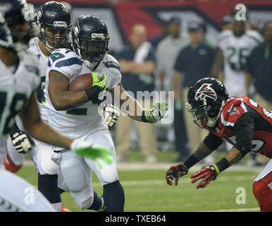 Atlanta Falcons safety William Moore (25) runs off the field after