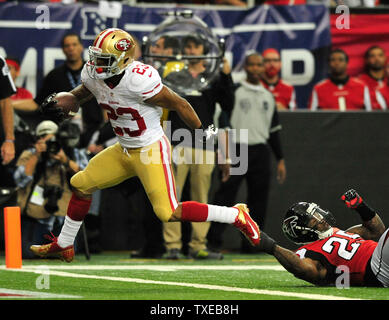 Atlanta Falcons safety William Moore (25) runs off the field after