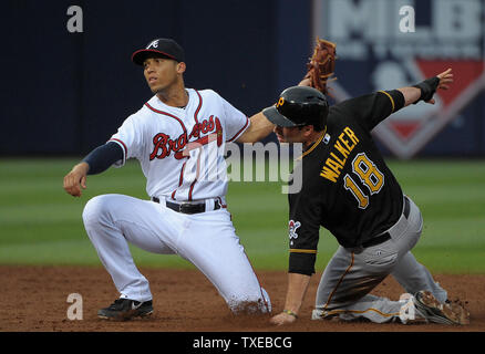 Pittsburgh Pirates' Neil Walker (18) advances to second base in front of Atlanta Braves shortstop Andrelton Simmons on a fly out in the third inning of their baseball game at Turner Field in Atlanta, June 3, 2013.  UPI/David Tulis Stock Photo