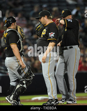 Pittsburgh Pirates relief pitcher Mike Zagurski conferences on the mound with catcher Michael McKenry and shortstop Clint Barmes, right, in the seventh inning against the Atlanta Braves at Turner Field in Atlanta, June 3, 2013.  UPI/David Tulis Stock Photo